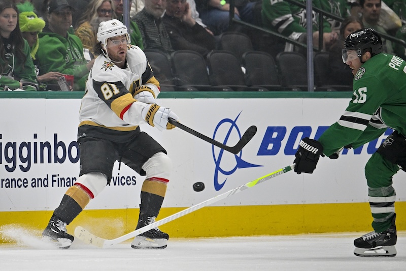 Vegas Golden Knights right wing Jonathan Marchessault (81) passes the puck past Dallas Stars center Joe Pavelski (16) during the third period in game one of the first round of the 2024 Stanley Cup Playoffs at the American Airlines Center.