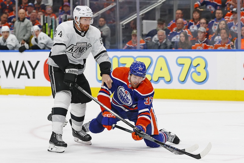 Los Angeles Kings defensemen Vladislav Gavrikov (84) trips up Edmonton Oilers forward Warren Foegele (37) during the third period in game five of the first round of the 2024 Stanley Cup Playoffs at Rogers Place.