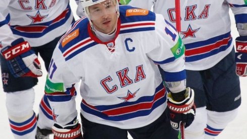 Ilya Kovalchuk celebrates with his teammates after scoring a goal