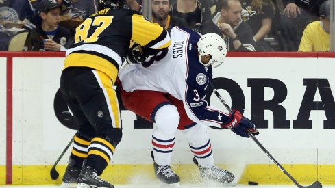 Seth Jones fends off Sidney Crosby