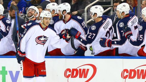 Alex Wennberg swings by the benches to celebrate after a goal.