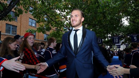 Alexander Wennberg walks on the blue carpet on Blue Jackets opening night.