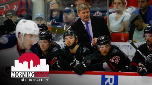 Bill Peters talks to the Carolina Hurricanes bench during play 