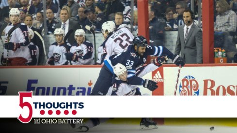 Blue Jackets forward Matt Calvert battles for the puck