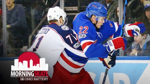 Nick Foligno checks Nick Holden into the boards at Madison Square Garden