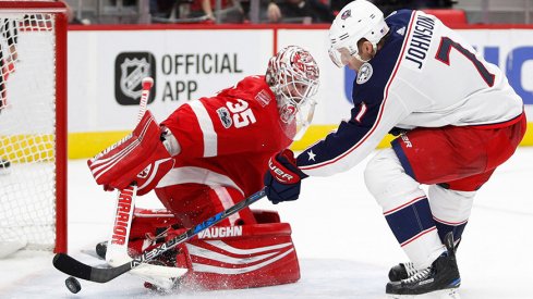 Jack Johnson slides a shootout winner past Detroit goalie Jimmy Howard on Saturday.