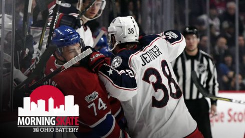 Boone Jenner lays out Alexei Emelin into the boards during a Blue Jackets-Canadiens game