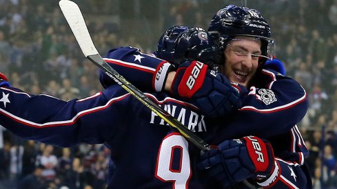 Pierre-Luc Dubois and Artemi Panarin celebrate a goal in the Blue Jackets' 4-2 win over the Ducks