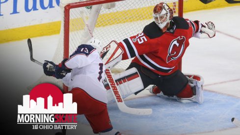 Cam Atkinson tries to get the puck past Cory Schneider