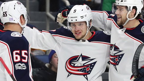 Josh Anderson and Markus Nutivaara congratulate Artemi Panarin.