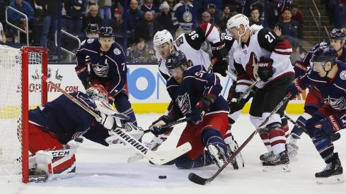 Sergei Bobrovsky scrambles to cover up the puck against a feisty Arizona Coyotes team