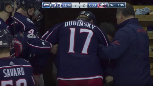 Brandon Dubinsky was slow to leave the ice after taking a punch to the face