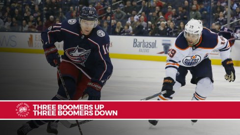 Matt Calvert tries to skate away from Oilers forward Patrick Maroon