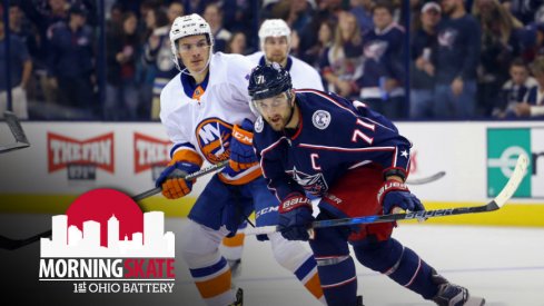 Nick Foligno tries to skate past Matthew Barzal