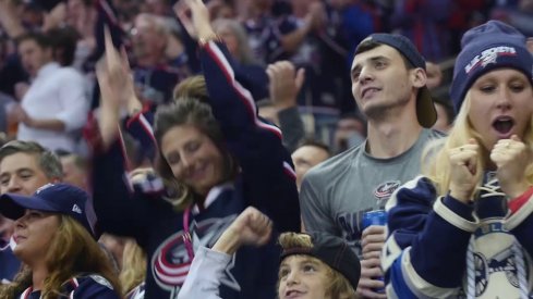 Fans celebrate a goal during the Blue Jackets new January opening video