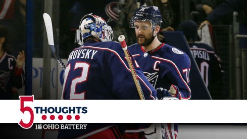 Blue Jackets captain Nick Foligno celebrates with Sergei Bobrovsky.