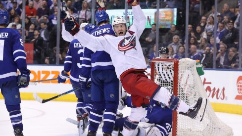 Boone Jenner celebrates Jordan Schroeder's goal to start the Blue Jackets comeback against the Leafs