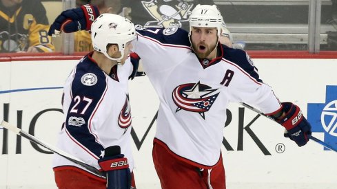 Brandon Dubinsky and Ryan Murray celebrate a goal scored against the Pittsburgh Penguins