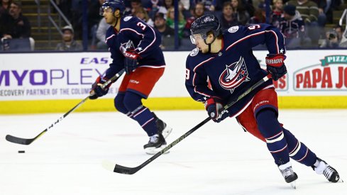 Blue Jackets Seth Jones and Artemi Panarin skate up the ice together with the puck