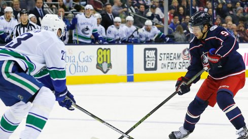 Artemi Panarin carries the puck against the Vancouver Canucks.