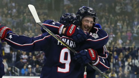 Pierre-Luc Dubois celebrates a goal with line mate Artemi Panarin