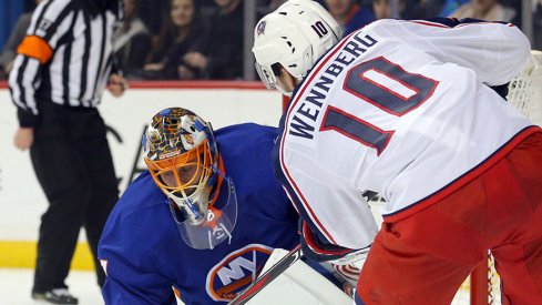 Jaroslav Halak stops an Alexander Wennberg shot 