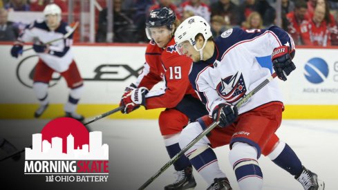 Artemi Panarin carries the puck against the Capitals while Niklas Backstrom pursues