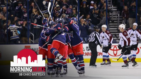 The Blue Jackets celebrate after scoring a goal against the Colorado Avalanche