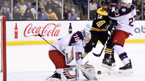 Blue Jackets defenseman Ian Cole boxes out in front Joonas Korpisalo