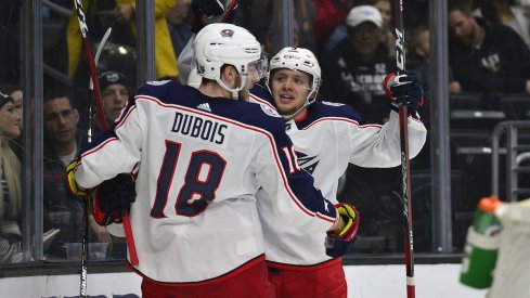 Pierre-Luc Dubois celebrates a goal with line mate Artemi Panarin