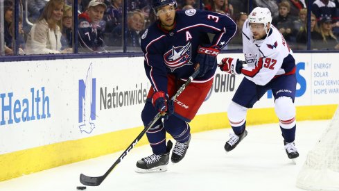 Seth Jones defends against Capitals center Evgeny Kuznetsov