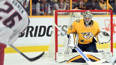 Thomas Vanek fires a shot on Predators goaltender Pekka Rinne.