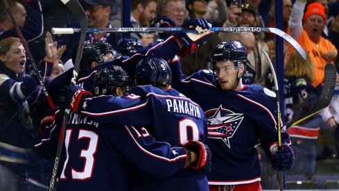 The Blue Jackets celebrate a goal by Cam Atkinson.