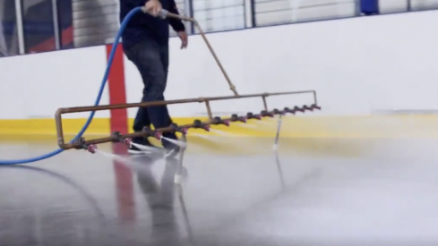 Ice technician Ian Huffman begins to lay a new sheet of ice at the OhioHealth Ice Haus.