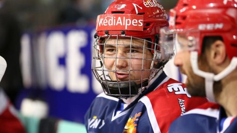 Alexandre Texier talks on the bench during a game