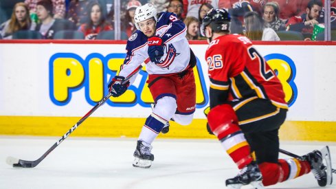 Artemi Panarin makes a pass against the Calgary Flames