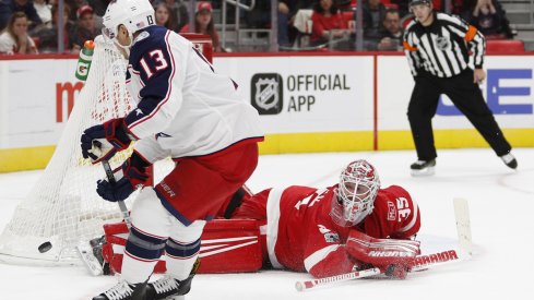 Columbus Blue Jackets forward Cam Atkinson attempts to beat Detroit Red Wings goaltender Jimmy Howard during a shootout at Little Caesars Arena.