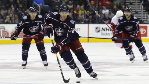 Boone Jenner leads Blue Jackets players down the ice to try and score.