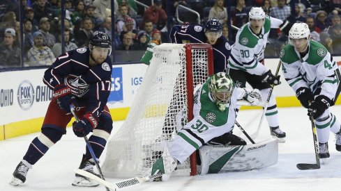 Brandon Dubinsky digs deep and tries to put the puck on net against Ben Bishop.