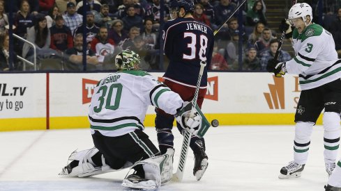 Boone Jenner screens Ben Bishop as a shot comes through