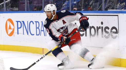 Seth Jones skates with the puck against the St Louis Blues 