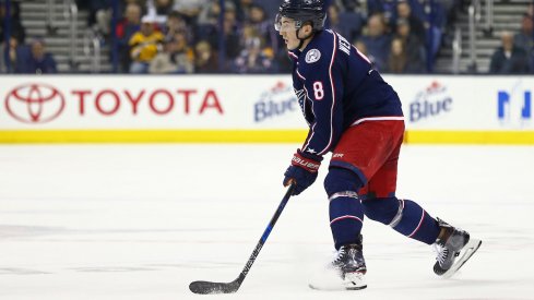 Columbus Blue Jackets defenseman Zach Werenski moves the puck during a game against the Pittsburgh Penguins at Nationwide Arena.