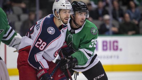 Oliver Bjorkstrand battles in front of the net with Dallas Stars defensemen Joel Hanley