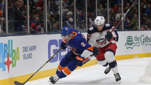 Columbus Blue Jackets center Lukas Sedlak defends against Islanders defenseman Nick Leddy at Nassau Coliseum.