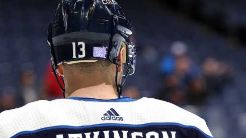 Cam Atkinson wears a Hockey Fights Cancer sticker during pregame warm ups.