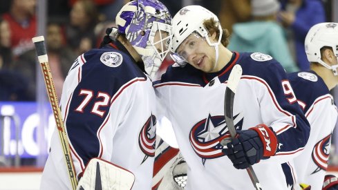 Artemi Panarin and Sergei Bobrovsky celebrate a win over the Washington Capitals at Capital One Arena.