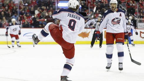 Artemi Panarin celebrates scoring with Seth Jones