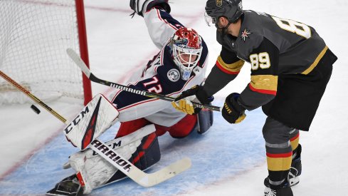 Columbus Blue Jackets goaltender Sergei Bobrovsky makes a breakaway save on Vegas Golden Knights forward Alex Tuch.