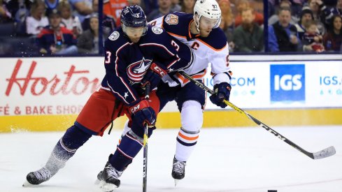 Columbus Blue Jackets defenseman Seth Jones defends against Edmonton Oilers captain Connor McDavid during a game at Nationwide Arena.