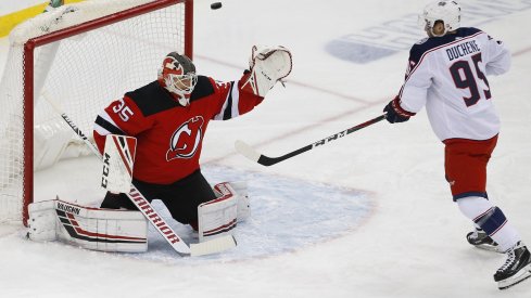 Cory Schneider keeps the puck out of the net against Matt Duchene during the first period at Prudential Center.